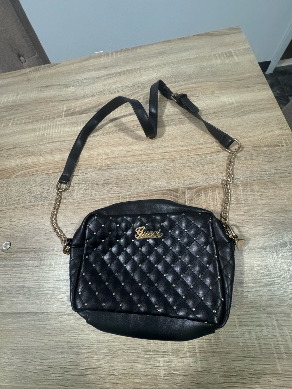 Black Quilted Crossbody Bag with Gold Chain and Stud Detail